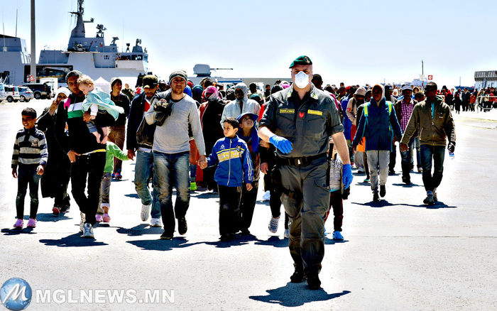 Rescued migrants walk along the quayside after disembarking from the Italian Navy vessel Bettica in the Sicilian harbour of Augusta on Wednesday. European governments came under increasing pressure to tackle the Mediterranean's migrant crisis ahead of an emergency summit, as harrowing details emerged of the fate of hundreds who died in the latest tragedy